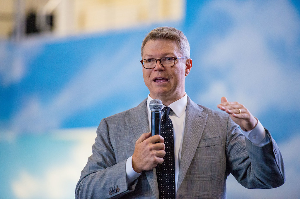 Speaker with a microphone giving a business talk